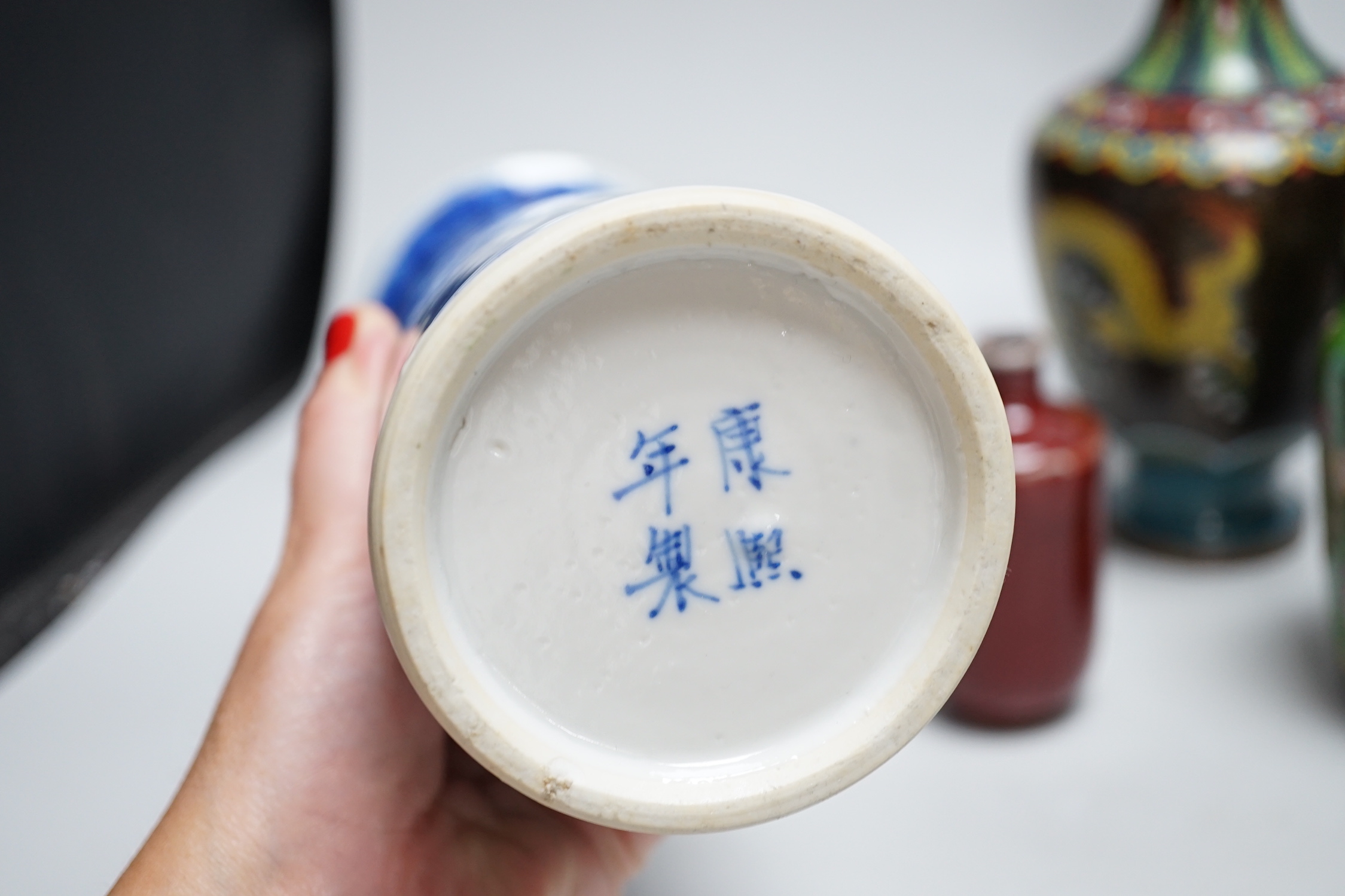 A group of Chinese porcelain and cloisonné enamel vases, tallest 25cm